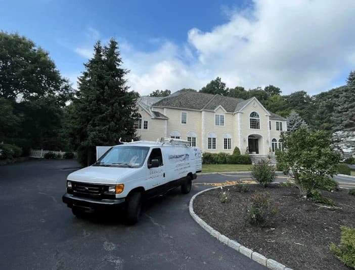 North Royalton Power Washing technician performing thorough gutter cleaning service in North Royalton