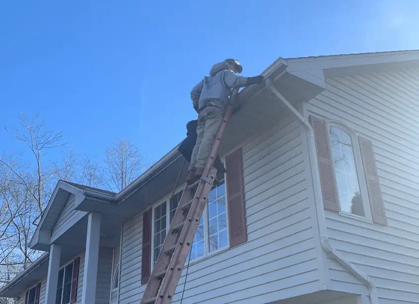 Gutter cleaning and maintenance being performed by North Royalton Power Washing in North Royalton